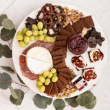 Sweet, Spiced & Bloomy Cheese Board with Blake Hill Raspberry Mostarda, Jasper Hill Farm Harbison cheese, Effie's Cocoa Biscuits, dark chocolate, pretzels, pistachios, salami, and green grapes