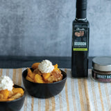 Bourbon Peach Cobbler made with Olivelle Bourbon Barrel Aged Balsamic and Smokey Bacon Sea Salt, served with vanilla ice cream