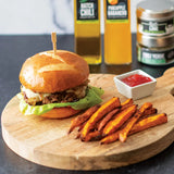 Green Chile Burger with Red Pepper Jam and Caramelized Onions made with Olivelle Green Chili Infused Olive Oil and Sweet Smoked Chili Rub, served with Chili Lime Sweet Potato Fries