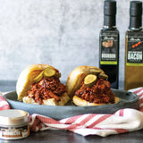 Classic Sweet and Smokey Pulled Pork Sandwich made with Olivelle Sweet Applewood Barbecue Rub, Maple-Wood Smoked Bacon Infused Olive Oil, and Bourbon Barrel Aged Balsamic BBQ sauce