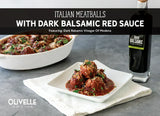 Italian meatballs in dark balsamic red sauce topped with fresh parsley and grated parmesan