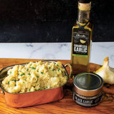 Garlic Parmesan Mashed Potatoes made with Olivelle Caramelized Garlic Infused Olive Oil and Black Garlic Sea Salt, topped with chives