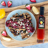 Grilled chicken thighs topped with warm strawberry chutney, sliced almonds, and fresh thyme