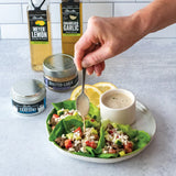 Lamb Wraps with Lemony Tahini Dressing made with Olivelle Caramelized Garlic Infused Olive Oil, Lemon and Dill Tzatziki Rub, and Meyer Lemon White Barrel Aged Balsamic