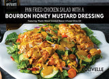 Pan Fried Chicken Salad with Bourbon Honey Mustard Dressing made with Olivelle Maple-Wood Smoked Bacon Infused Olive Oil and Bourbon Barrel Aged Balsamic, topped with bacon, cheddar, tomatoes, and cucumbers