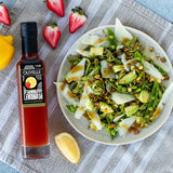 Shaved asparagus salad with snap peas, avocado, shaved parmesan, and pistachios with a balsamic dressing