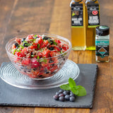 Watermelon Berry Salad with blueberries, strawberries, coconut, and chia seeds, tossed in an Olivelle Blood Orange Infused Olive Oil and Barrel Aged White Balsamic dressing
