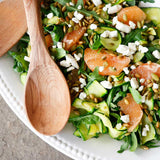 Zucchini Ribbon and Grapefruit Salad with spinach, arugula, feta, and pumpkin seeds dressed in Olivelle Basil Genovese Infused Olive Oil and Meyer Lemon White Barrel Aged Balsamic