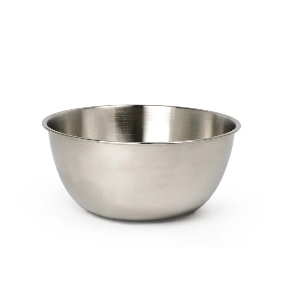 Stainless steel mixing bowl on a white background