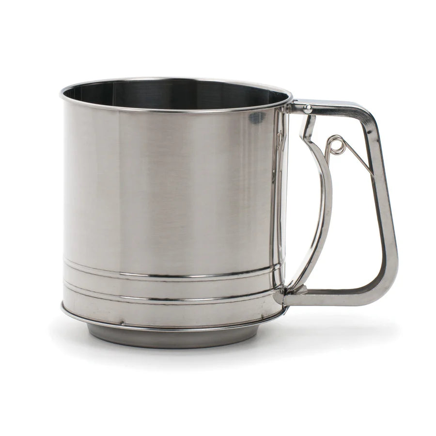 Stainless steel mug with handle on a white background