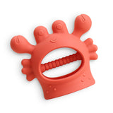 Red silicone teething ring with a white background