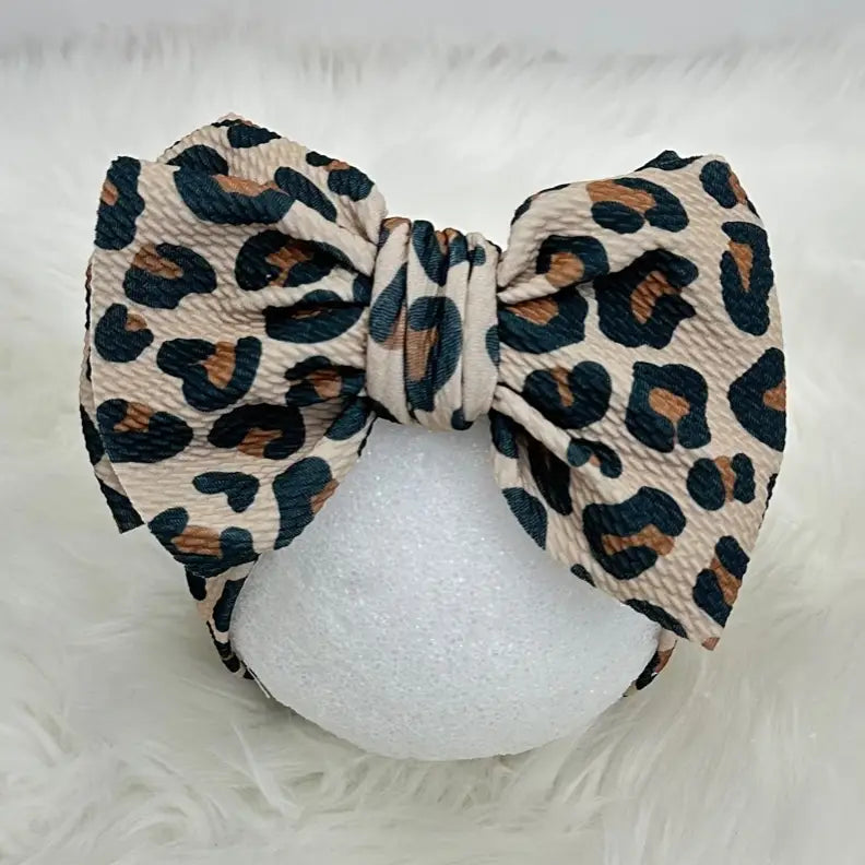 Leopard print headband on a white background