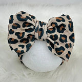 Leopard print headband on a white background
