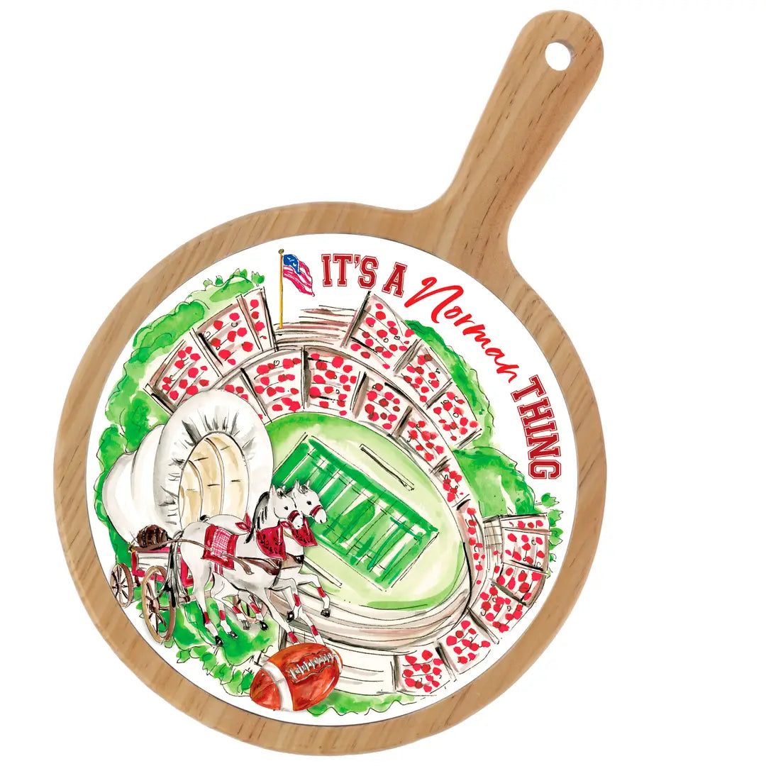 Decorative plate with football design and 'It's a Missouri Thing' text on a wooden handle.