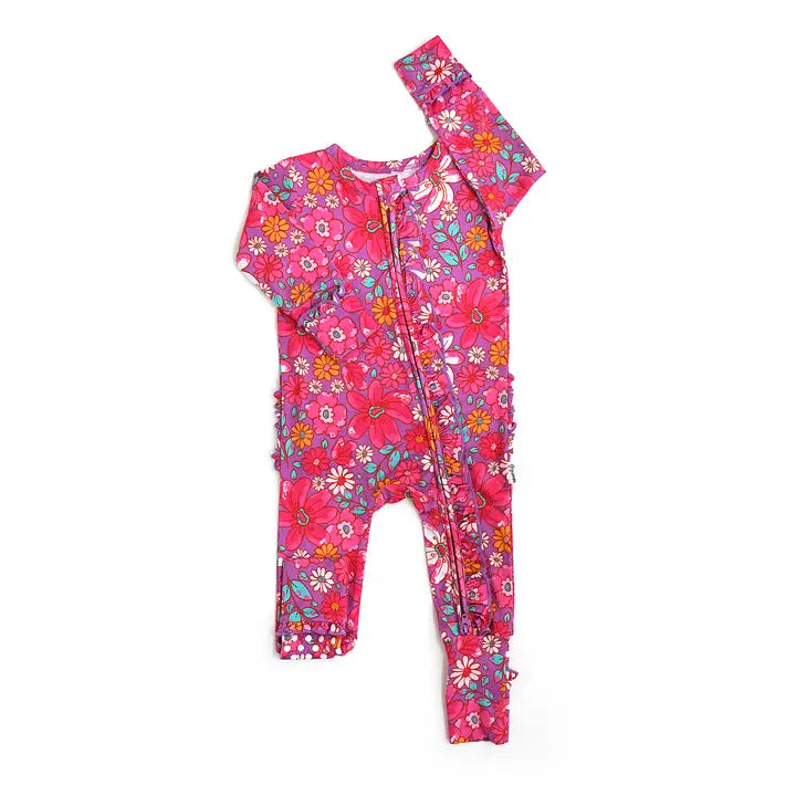 Pink floral baby romper on a white background