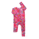 Pink floral baby romper on a white background