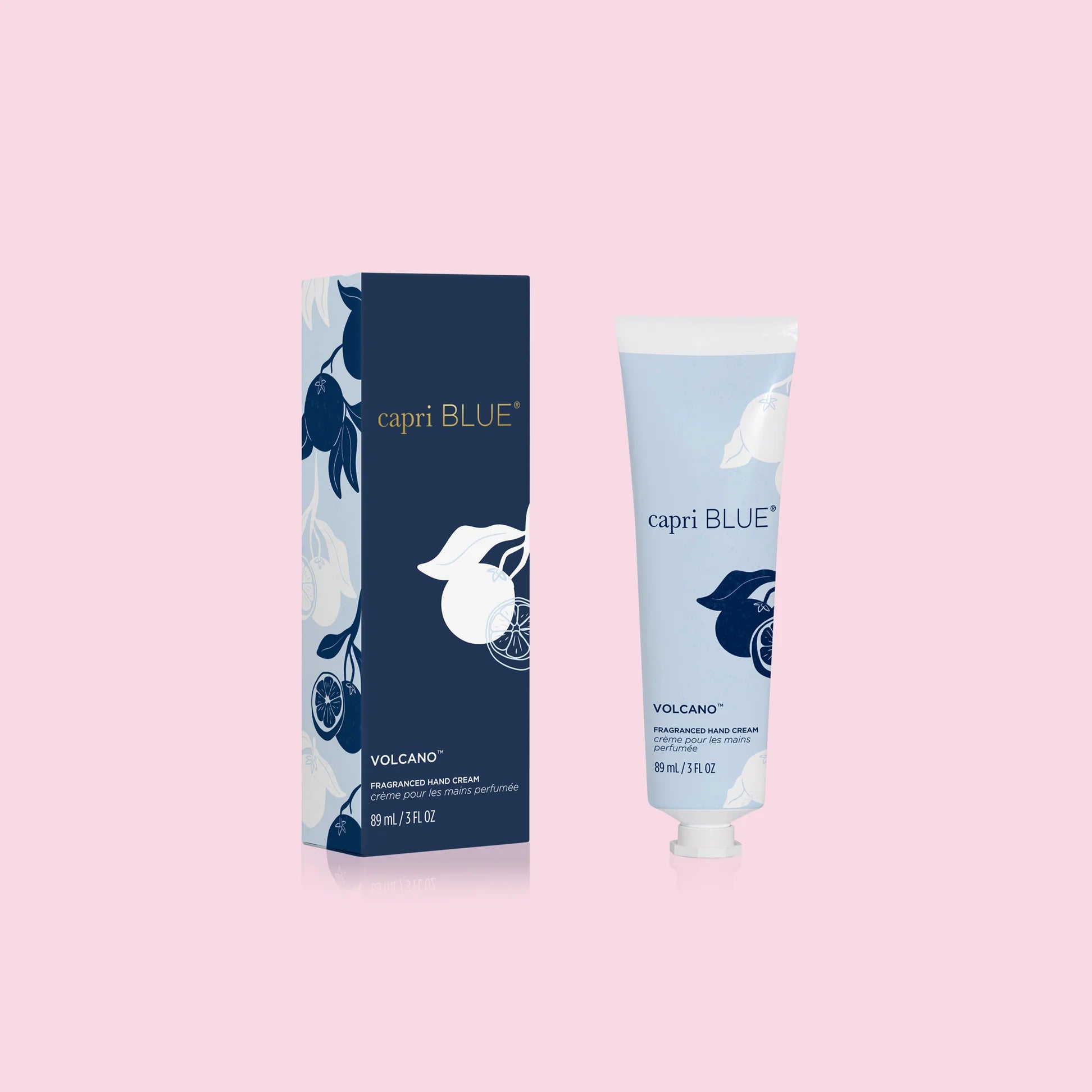 A bottle of hand lotion next to its packaging, with both featuring a white and blue color scheme and floral design.