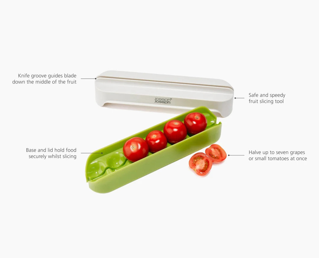 Vegetable slicer with tomatoes on a white background