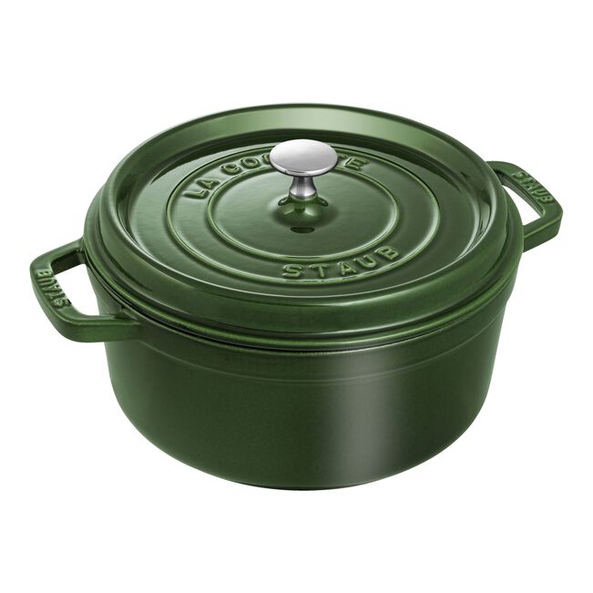 Green Staub cocotte on a white background