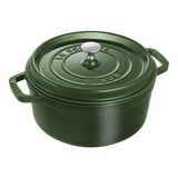 Green Staub cocotte on a white background