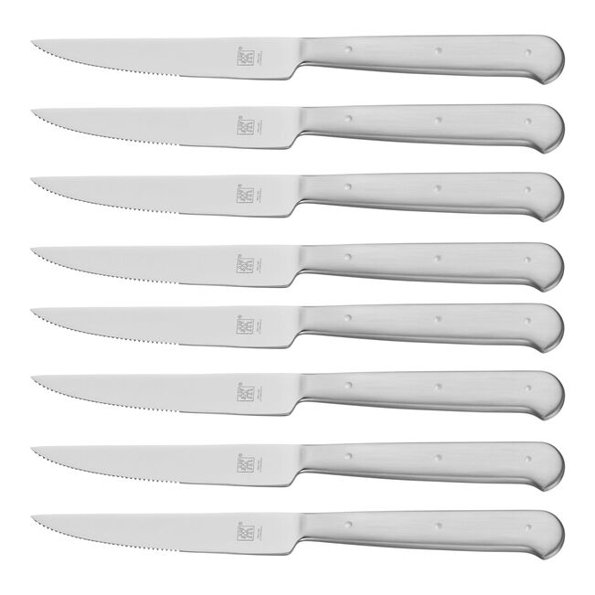 Set of eight silver steak knives with a brand logo on a white background