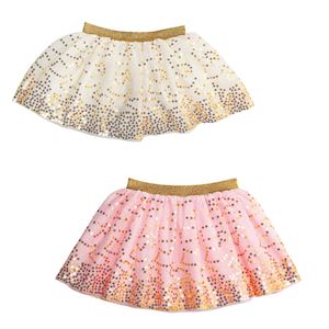 Two children's tutu skirts with sequin details on a white background