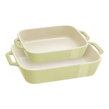 Set of three green rectangular baking dishes on a white background