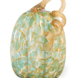 Decorative glass pumpkin with gold accents on a white background