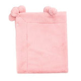 Pink plush blanket with pom-pom ears on a white background
