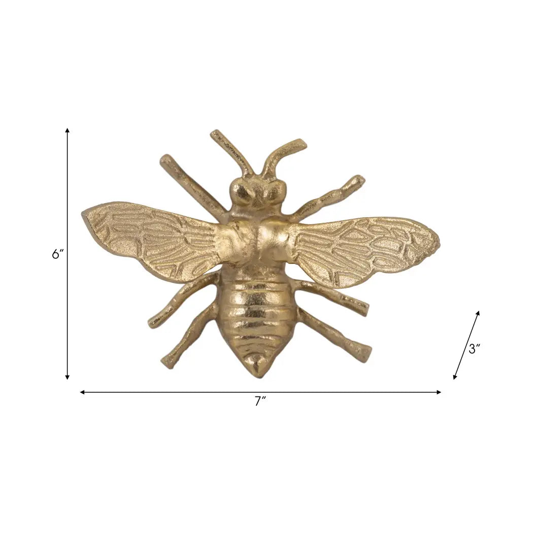Gold bee-shaped decorative item with measurements on a white background