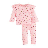A 2-piece pink pajama set for toddlers, with ladybug prints on the top and pants.