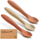 Three baby spoons in terracotta and beige colors with a KeaBabies packaging box.