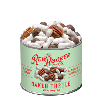 Green tin of 'Naked Turtle' candy with pecans and white candies on a white background