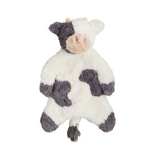 Plush cow toy with black and white pattern on a white background
