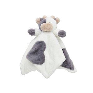 Plush cow toy with a white and gray pattern on a white background