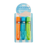 Three bubble wands in orange, blue, and green packaging on a white background