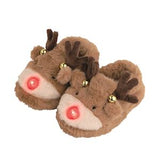Pair of reindeer-themed slippers with red glowing eyes on a white background
