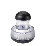 Black and silver pepper grinder on a white background