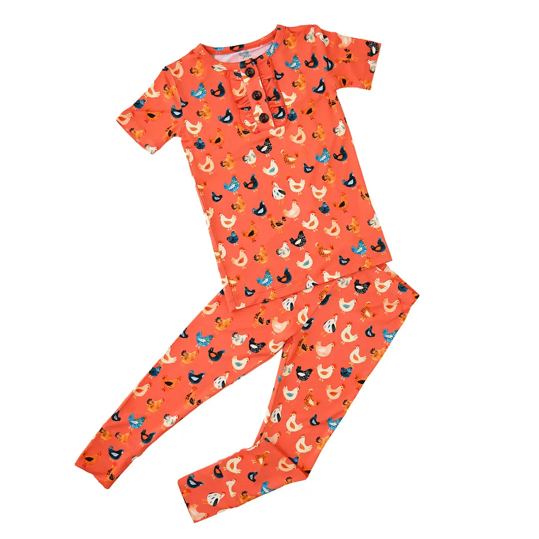 Children's pajama set with animal pattern on a white background