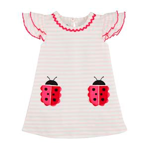 A short-sleeved white t-shirt dress with red stripes and ladybug appliques on the front.