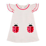 A short-sleeved white t-shirt dress with red stripes and ladybug appliques on the front.