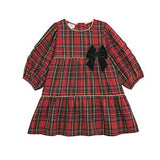 A red tartan plaid dress for toddlers or girls, featuring three-quarter puff sleeves, a tiered ruffle hem, and a large dark green velvet bow on the chest.