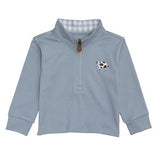 Blue long-sleeve shirt with a cow design on a white background