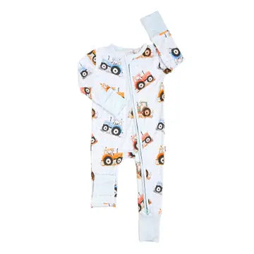 A baby long-sleeve footless zip-up sleeper in white, featuring an all-over print of colorful cartoon construction vehicles including tractors, dump trucks, and cranes.