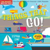 Children's book cover titled "Things That Go!" by Stephan Lomp, featuring colorful cartoon illustrations of vehicles, a hot air balloon, a helicopter, a sailboat, a boat, and flying objects on a bright illustrated background. Text at the top reads "The Original Indestructibles" and includes claims like chew proof, rip proof, nontoxic, and 100% washable.