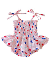 Pink baby romper with star pattern on a white background