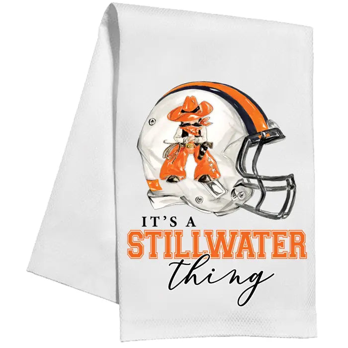 Towel with a football helmet graphic and 'It's a Stillwater Thing' text on a white background