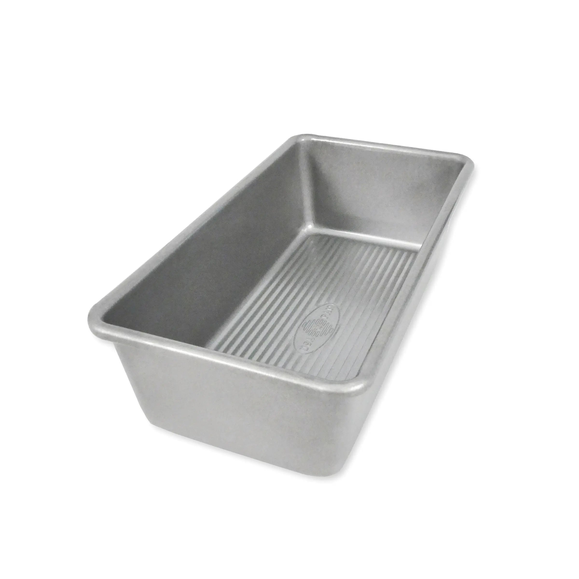 A rectangular aluminum loaf pan with a ribbed non-stick interior, shown at an angle on a plain white background.