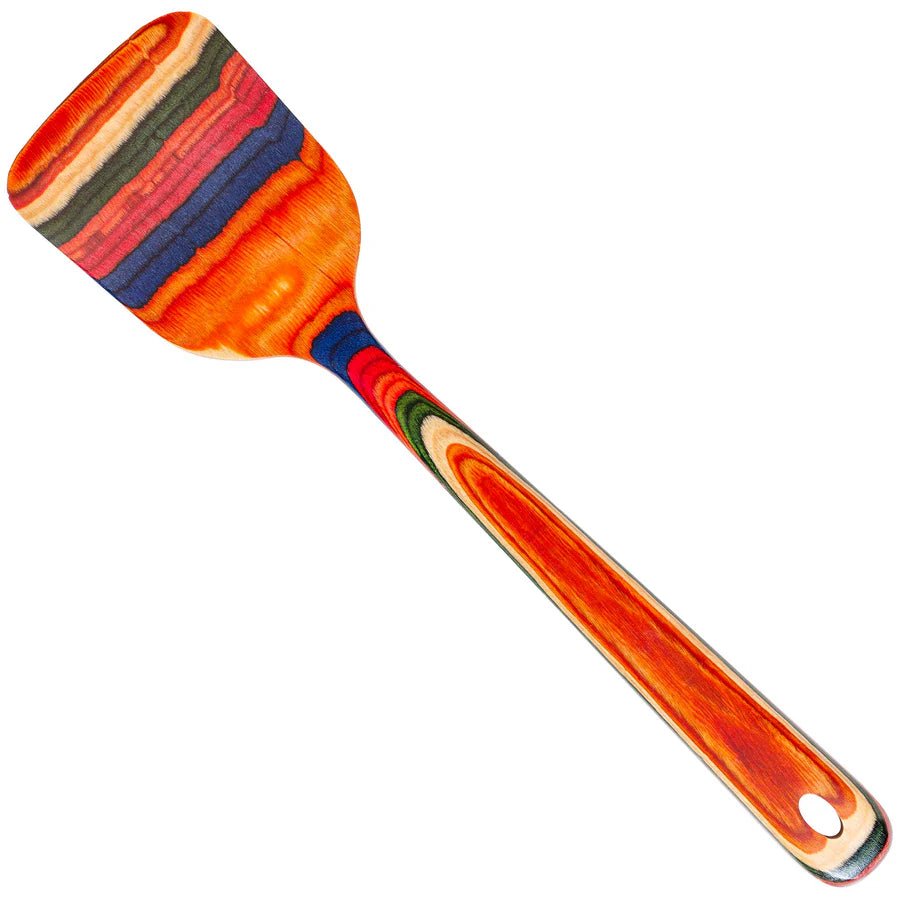 Colorful spatula with a wooden handle on a white background