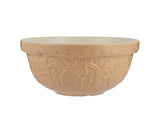 Beige ceramic mixing bowl with decorative patterns on a white background